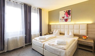 bilde på Superior Triple Room-2 Twin Beds and 1 Large Twin Sofa Bed Free WiFi